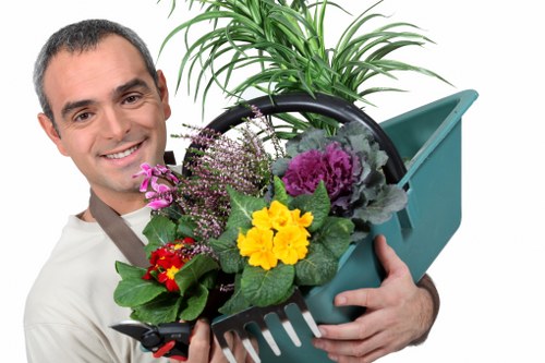 Volunteers sorting garden waste into bins